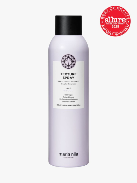 Maria Nila Texture Spray in branded purple bottle with black cap on light gray background with red Allure Best of Beauty seal in the top right corner