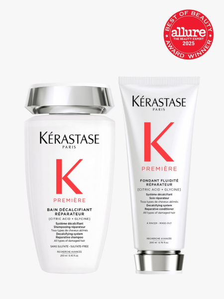 Kérastase Première Bain Décalcifiant Réparateur and Première Fondant Fluidité Réparateur white and silver bottle and tube of shampoo and conditioner on light gray background with red Allure Best of Beauty seal in the top right corner